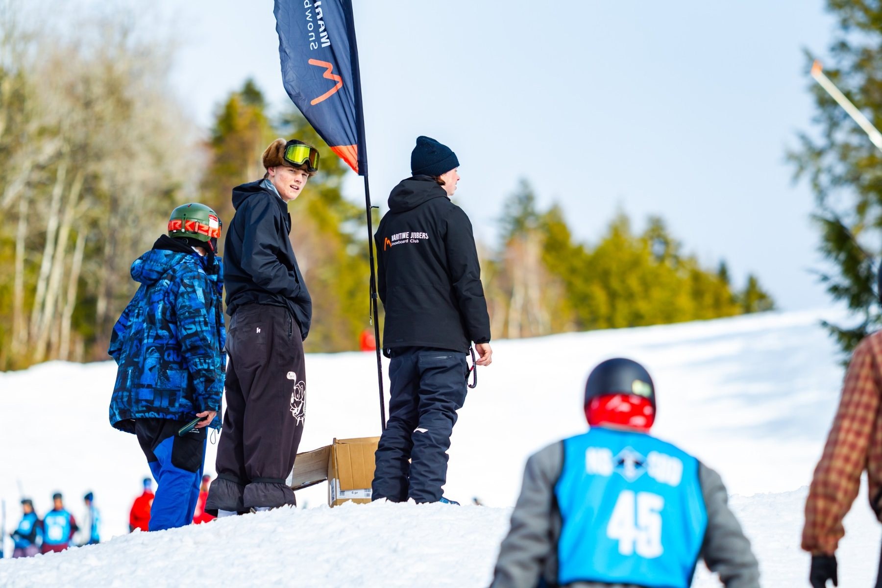 Maritime Jibbers riders and coach together on snow